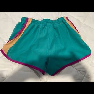 Teal w/ purple accent stripes Nike running shorts